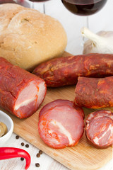 smoked sausages with bread and red wine