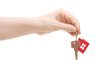 woman is handing a house key on a white background