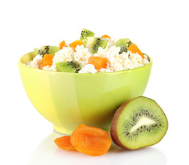 Cottage cheese in color bowl with fruits, isolated on white