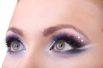 Fototapeta premium Beautiful female eyes with bright blue make-up