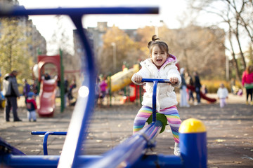 Fototapeta na wymiar Girl at the playground