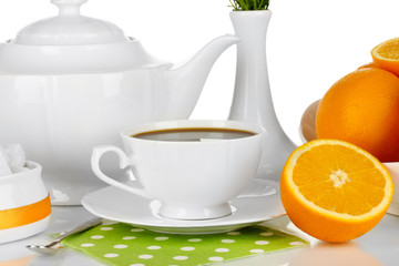 Beautiful white dinner service with oranges isolated on white