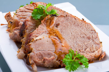 Slices of homemade roast pork on the plate