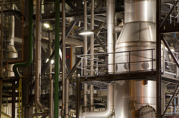 Close-up of industrial pipelines of an oil-refinery plant