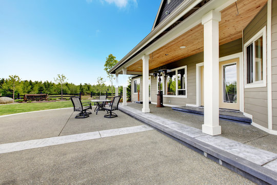 Large Farm Country House With Long Covered Porch.