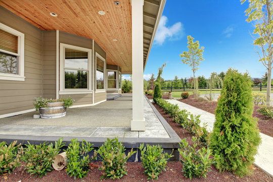 Large Farm Country House With Long Covered Porch.