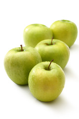 Green apples on white background