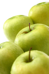 Green apples on white background