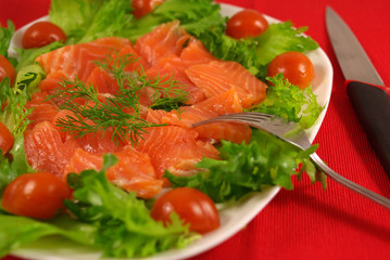 Trout with vegetables on a platter