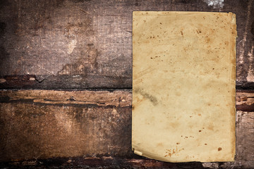 Blank vintage paper sheet on a dark wooden background