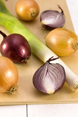 different onions on a wooden board