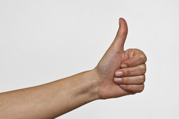 OK Hand Sign Made by woman on white background