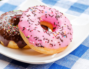 Fresh donuts on nature background