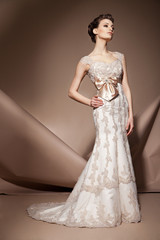 The beautiful young woman in a wedding dress