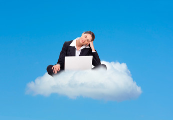 Business woman dreaming on a cloud