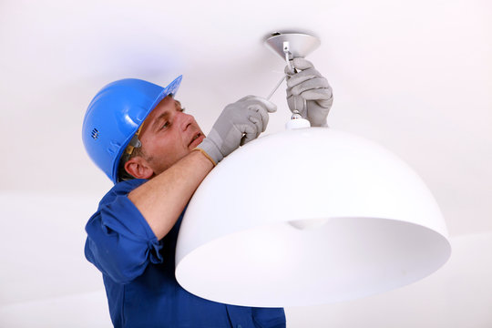 Installing the ceiling light.