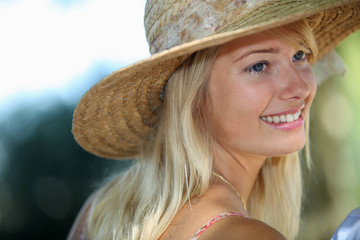 Summery woman in a straw hat