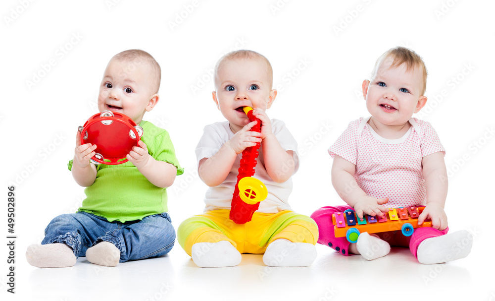 Fototapete Children playing with musical toys. Isolated on white background