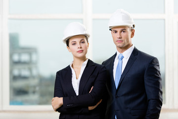 Portrait of two contractors standing near each other