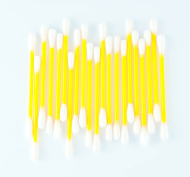 Cotton swabs over a white background