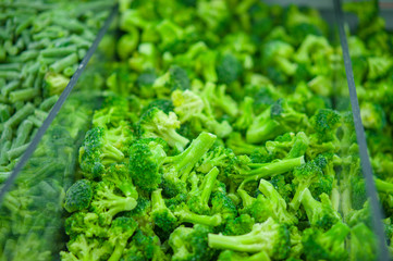 Frozen broccoli in fridge in supermarket