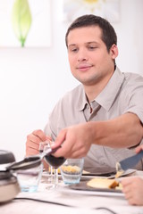 Man eating raclette