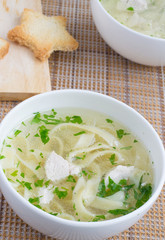 Chicken soup with noodles and parsley