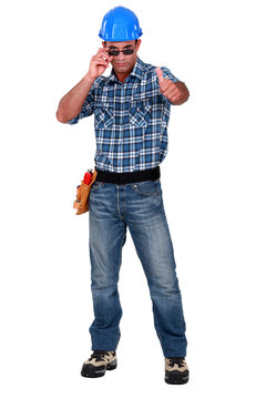 Confident construction worker on white background