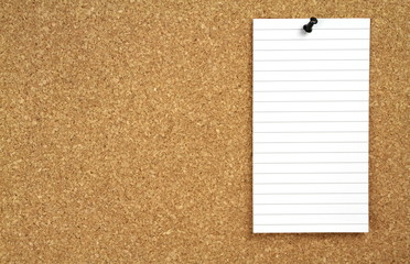 Cork notice board and white blank note papers