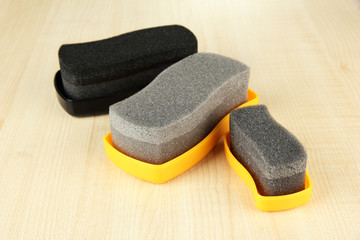Shoe shine sponges, on wooden background