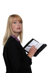 Woman writing in her agenda