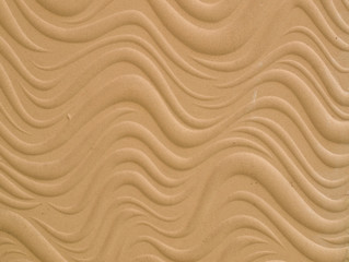 Texture of wave pattern's white cement bas relief wall