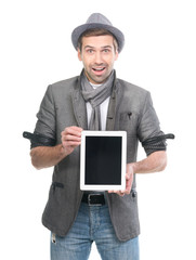 Handsome surprised man in hat showing digital tablet pc. Isolate