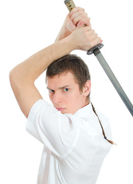 Young man threatening with sword. Isolated on white
