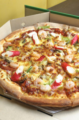 Seafood pizza in a box