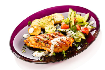 Grilled steak, baked potatoes and vegetables