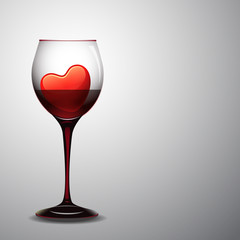 Red hearts in wine glass.