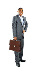 Portrait of a african business man carrying a suitcase