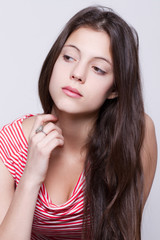 beautiful young girl looking up and thinking