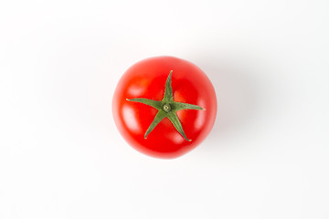 fresh tomato detail with copy space on white background