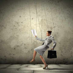 Business woman marionette