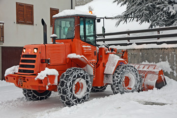 snow plough scraper to remove all the snow from the road