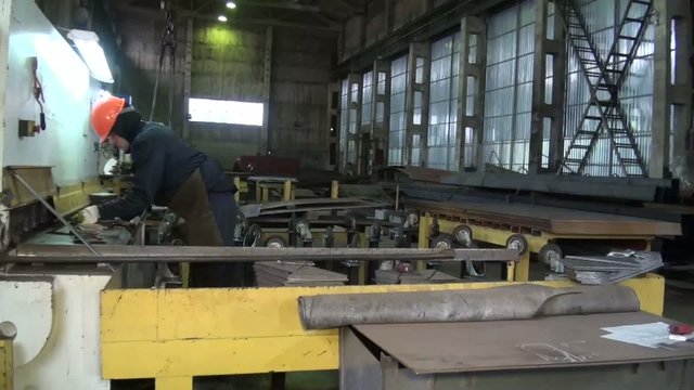 close-up of the machine that bends the metal plate at the factor