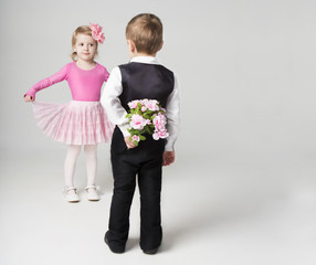 Boy hiding and going to give a girl a bouquet