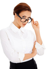 Woman peering over her glasses