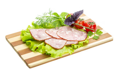 Sausages with salad and basil