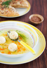 Soup with turkey meatballs, carrots and tselery, selective focus