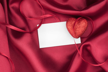 Red heart with a white card