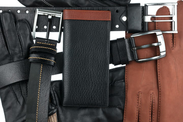 Men's wallet lying on the belts and gloves