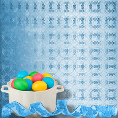 Pastel ornamental background with multicolored eggs in a bowl to